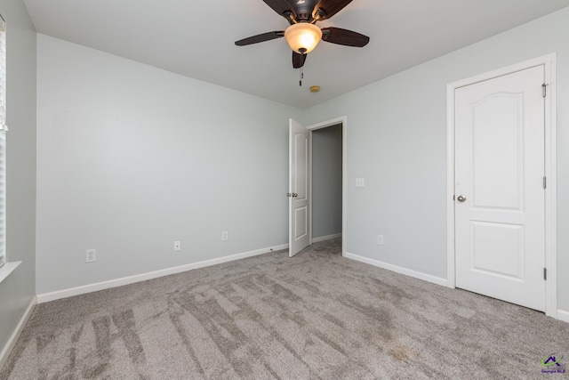 101 Bryce Dr, Warner Robins, GA 31088 - unfurnished bedroom with ceiling fan, carpet floors, and baseboards