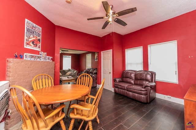dining room with ceiling fan, baseboards, and a textured ceiling