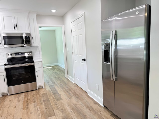 407 Frank Satterfield Rd, Perry, GA 31069 - kitchen featuring appliances with stainless steel finishes, white cabinetry, light countertops, baseboards, and recessed lighting