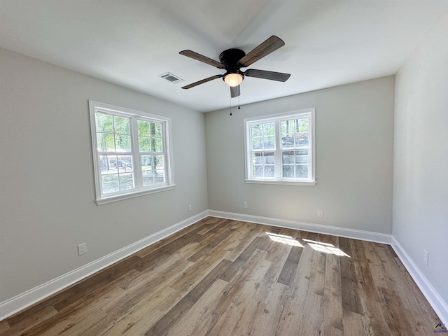 407 Frank Satterfield Rd, Perry, GA 31069 - spare room with wood finished floors, a ceiling fan, and baseboards