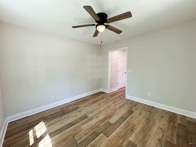 407 Frank Satterfield Rd, Perry, GA 31069 - spare room with wood finished floors, baseboards, and a ceiling fan