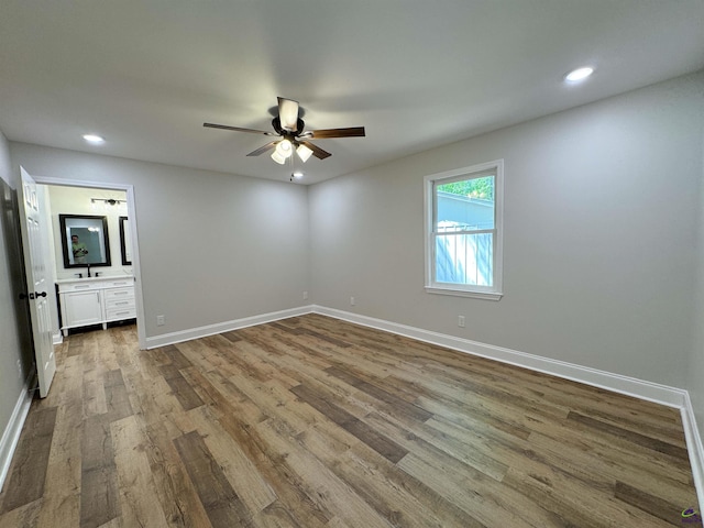 407 Frank Satterfield Rd, Perry, GA 31069 - spare room with wood finished floors, ceiling fan, baseboards, and recessed lighting