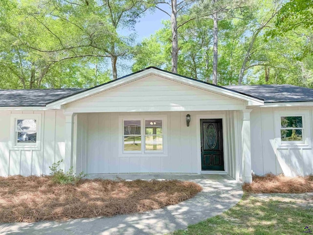 407 Frank Satterfield Rd, Perry, GA 31069 - view of front of house featuring roof with shingles, board and batten siding, and covered porch