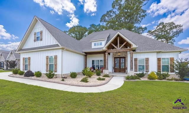 315 Apalachee Way, Bonaire, GA 31005 - view of front facade featuring a front yard, board and batten siding, french doors, and roof with shingles