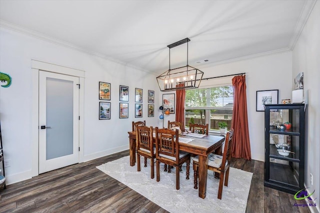 315 Apalachee Way, Bonaire, GA 31005 - dining area with crown molding, a notable chandelier, baseboards, and dark wood finished floors