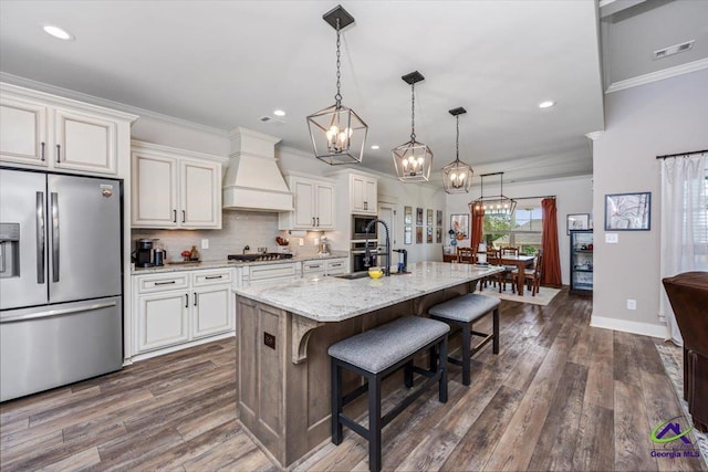 315 Apalachee Way, Bonaire, GA 31005 - kitchen featuring premium range hood, a breakfast bar, dark wood-style floors, and stainless steel appliances