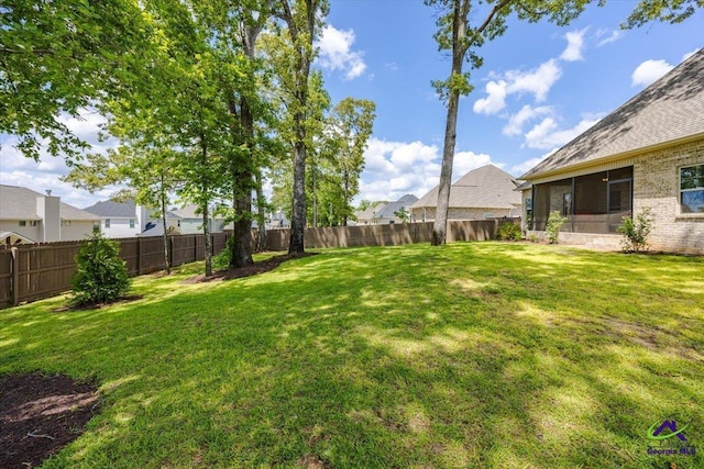 315 Apalachee Way, Bonaire, GA 31005 - view of yard featuring a fenced backyard, a residential view, and a sunroom
