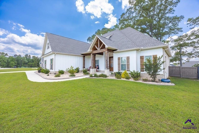 315 Apalachee Way, Bonaire, GA 31005 - view of front facade featuring a front lawn, roof with shingles, and fence