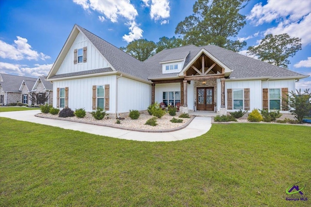 315 Apalachee Way, Bonaire, GA 31005 - view of front of property featuring board and batten siding, a front yard, and french doors
