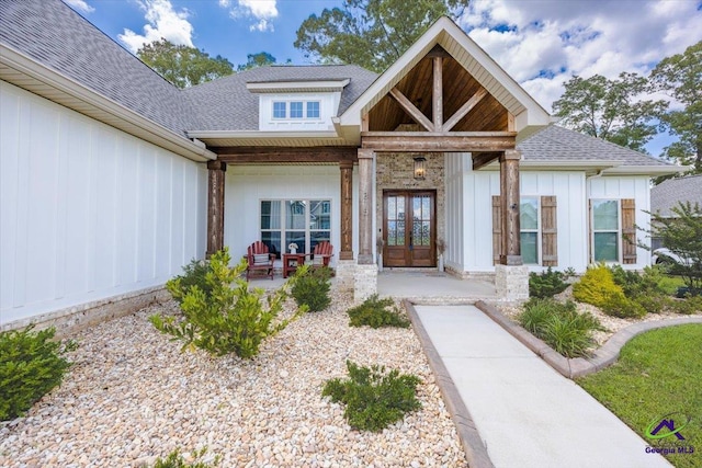 315 Apalachee Way, Bonaire, GA 31005 - doorway to property with french doors, board and batten siding, and roof with shingles