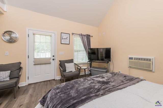 105 Taconic Ct, Bonaire, GA 31005 - bedroom featuring baseboards, high vaulted ceiling, wood finished floors, and an AC wall unit