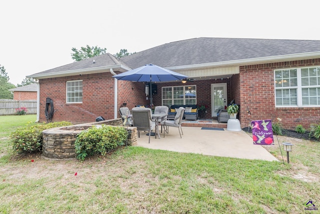 105 Taconic Ct, Bonaire, GA 31005 - back of property with brick siding, fence, a yard, and a patio area
