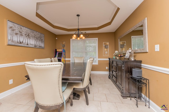 105 Taconic Ct, Bonaire, GA 31005 - dining room with light tile patterned floors, an inviting chandelier, ornamental molding, and a raised ceiling