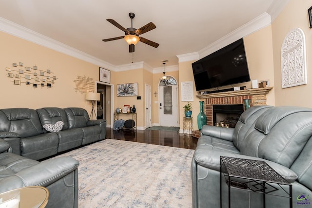 105 Taconic Ct, Bonaire, GA 31005 - living area with a brick fireplace, ceiling fan, dark wood-type flooring, crown molding, and baseboards