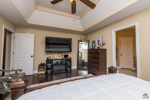 105 Taconic Ct, Bonaire, GA 31005 - bedroom with baseboards, a raised ceiling, ceiling fan, and wood finished floors