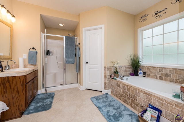 105 Taconic Ct, Bonaire, GA 31005 - bathroom with a stall shower, a garden tub, tile patterned flooring, and vanity