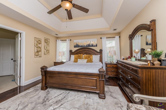 105 Taconic Ct, Bonaire, GA 31005 - bedroom with visible vents, a raised ceiling, wood finished floors, and multiple windows