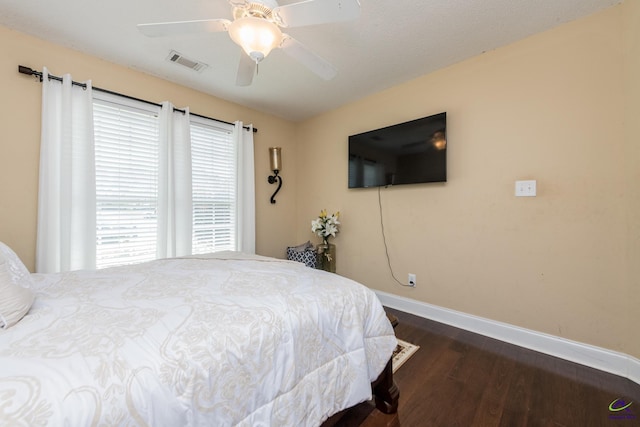 105 Taconic Ct, Bonaire, GA 31005 - bedroom featuring dark wood-style floors, visible vents, ceiling fan, and baseboards