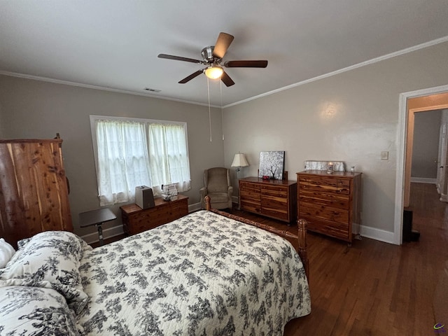 bedroom featuring crown molding, a ceiling fan, baseboards, wood finished floors, and visible vents