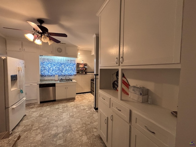 kitchen featuring ceiling fan, crown molding, dishwasher, a sink, and white fridge with ice dispenser