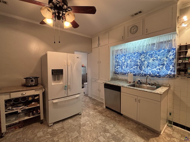kitchen with ceiling fan, visible vents, stainless steel dishwasher, a sink, and white fridge with ice dispenser