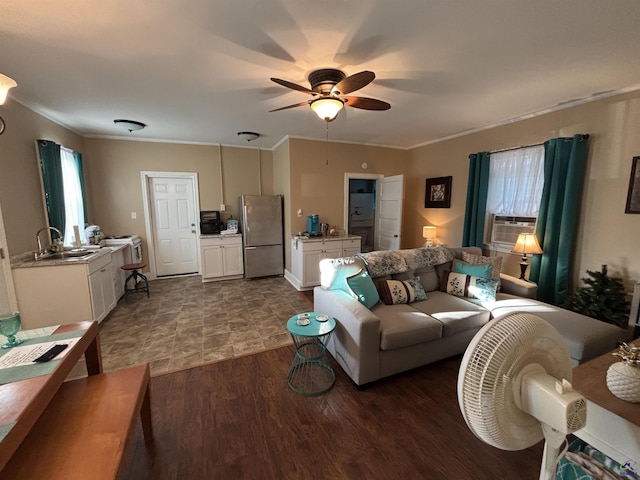 living room featuring dark wood-type flooring, ornamental molding, ceiling fan, and cooling unit