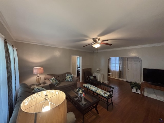 living room featuring baseboards, a ceiling fan, wood finished floors, and ornamental molding