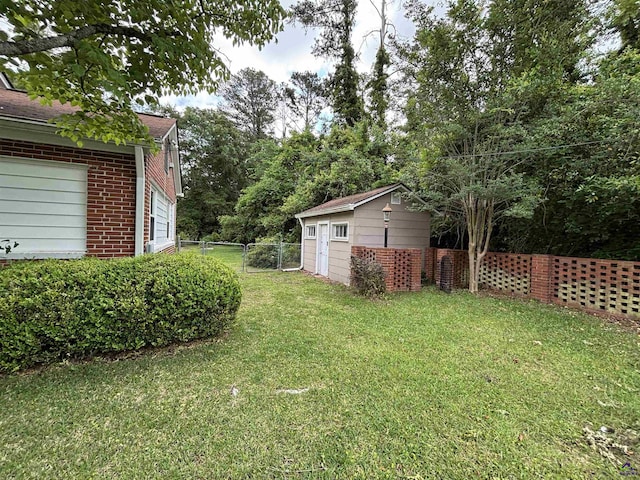 view of yard featuring an outdoor structure and fence