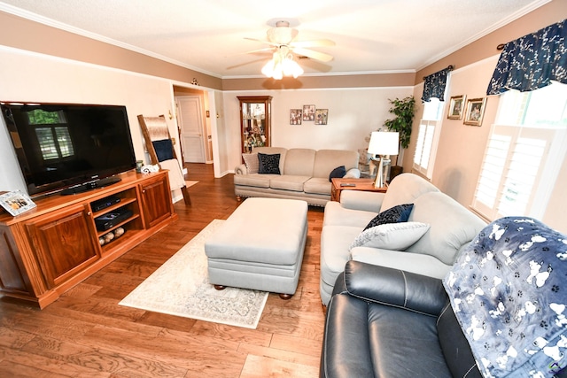 living room featuring crown molding, a ceiling fan, and wood finished floors