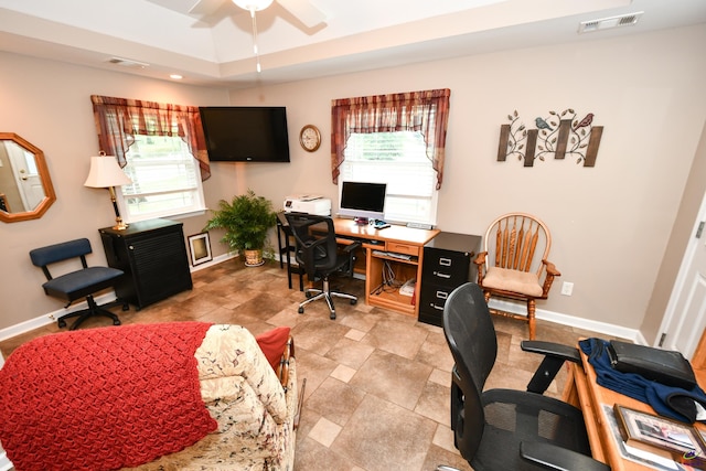 home office with a ceiling fan, baseboards, and visible vents