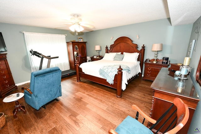 bedroom featuring a ceiling fan and wood finished floors
