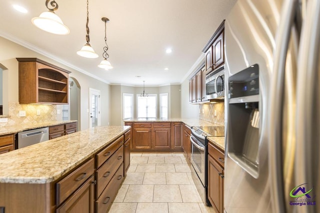 kitchen with open shelves, light stone counters, stainless steel appliances, tasteful backsplash, and ornamental molding