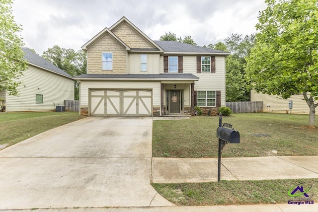 view of front of house with an attached garage, driveway, a front lawn, and stone siding