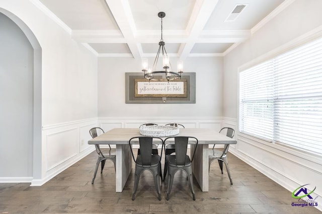dining room with visible vents, arched walkways, beam ceiling, an inviting chandelier, and coffered ceiling