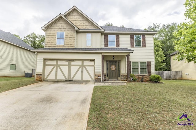 craftsman-style home featuring a garage, stone siding, a front yard, cooling unit, and driveway