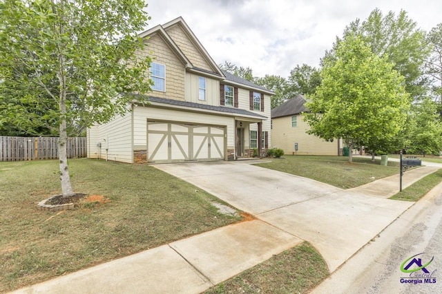 view of front of property with fence, a garage, board and batten siding, a front yard, and driveway