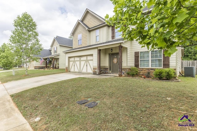 craftsman-style house with central AC, stone siding, a front yard, an attached garage, and driveway