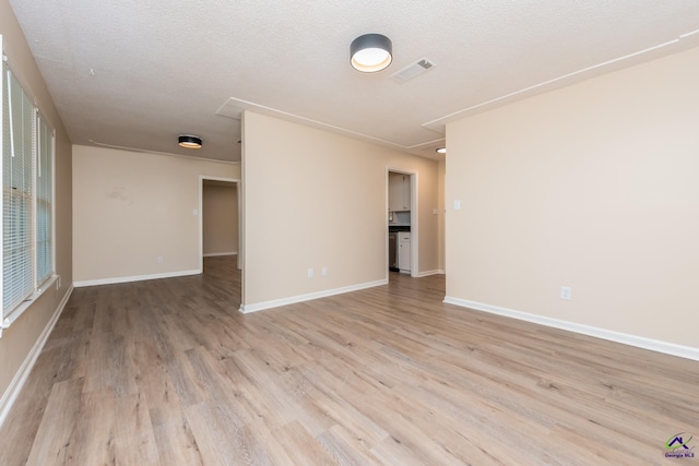 133 Avalon Dr, Warner Robins, GA 31093 - spare room featuring light wood-style floors, attic access, baseboards, and visible vents