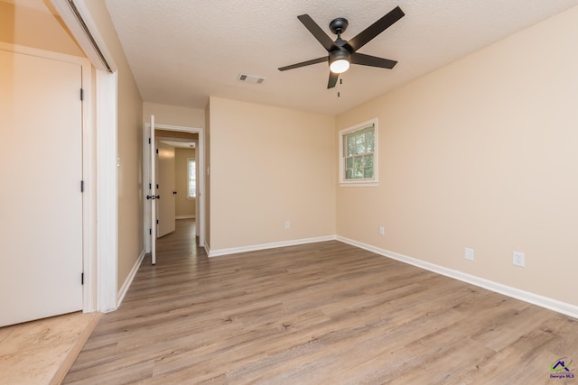 133 Avalon Dr, Warner Robins, GA 31093 - unfurnished bedroom with baseboards, visible vents, multiple windows, and light wood-style floors