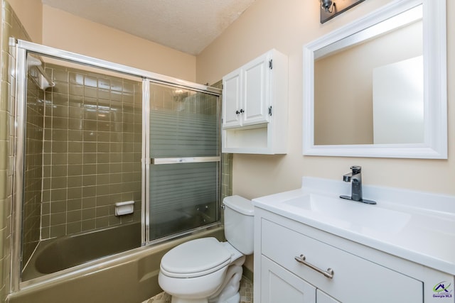 133 Avalon Dr, Warner Robins, GA 31093 - full bathroom with vanity, combined bath / shower with glass door, toilet, and a textured ceiling