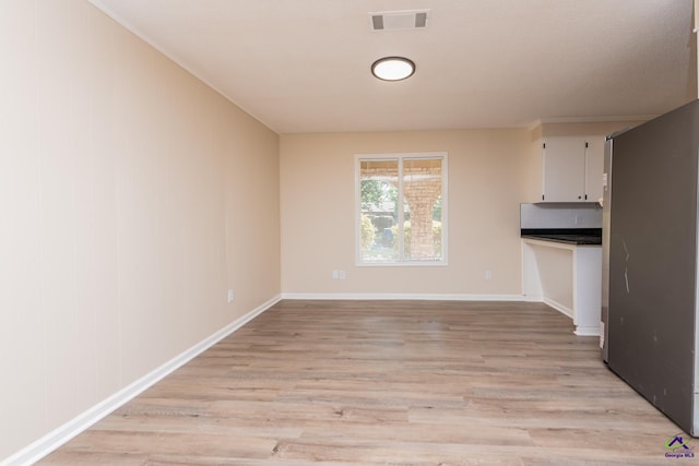 133 Avalon Dr, Warner Robins, GA 31093 - unfurnished dining area with visible vents, light wood finished floors, and baseboards