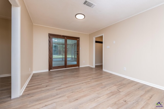 133 Avalon Dr, Warner Robins, GA 31093 - spare room with visible vents, light wood-style floors, crown molding, and baseboards