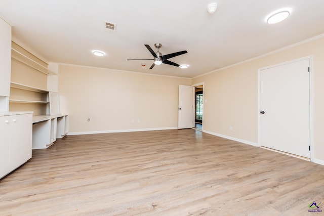 133 Avalon Dr, Warner Robins, GA 31093 - unfurnished living room featuring crown molding, visible vents, baseboards, a ceiling fan, and light wood-style flooring