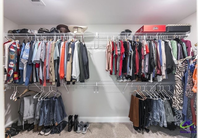 spacious closet featuring visible vents and carpet flooring