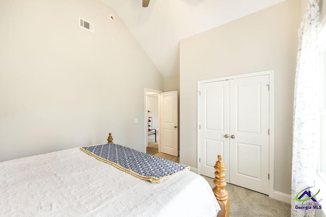 bedroom featuring visible vents, a closet, light carpet, baseboards, and a ceiling fan