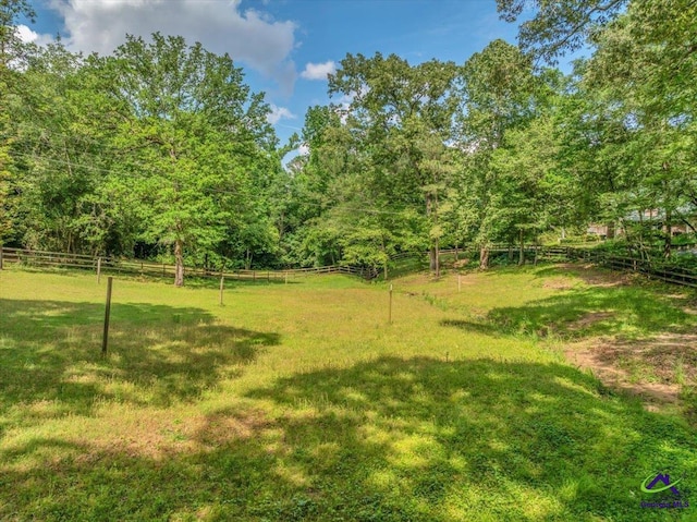 124 Joy Dr, Warner Robins, GA 31088 - view of yard featuring a rural view, fence, and a wooded view