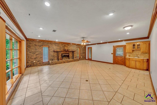 124 Joy Dr, Warner Robins, GA 31088 - unfurnished living room featuring ornamental molding, a ceiling fan, and a healthy amount of sunlight