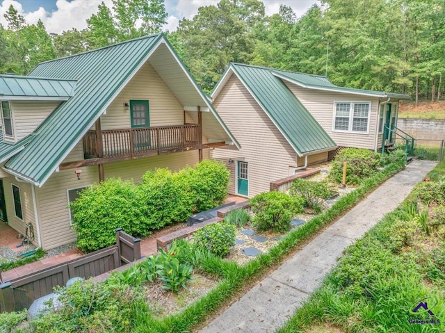 124 Joy Dr, Warner Robins, GA 31088 - rear view of house featuring metal roof and a standing seam roof