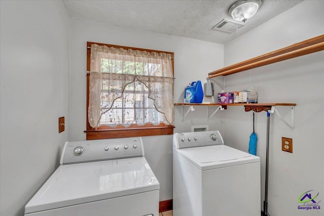 124 Joy Dr, Warner Robins, GA 31088 - washroom with laundry area, a textured ceiling, visible vents, and washing machine and clothes dryer