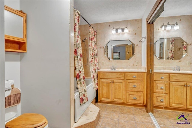 124 Joy Dr, Warner Robins, GA 31088 - bathroom with a sink, toilet, double vanity, and shower / tub combo